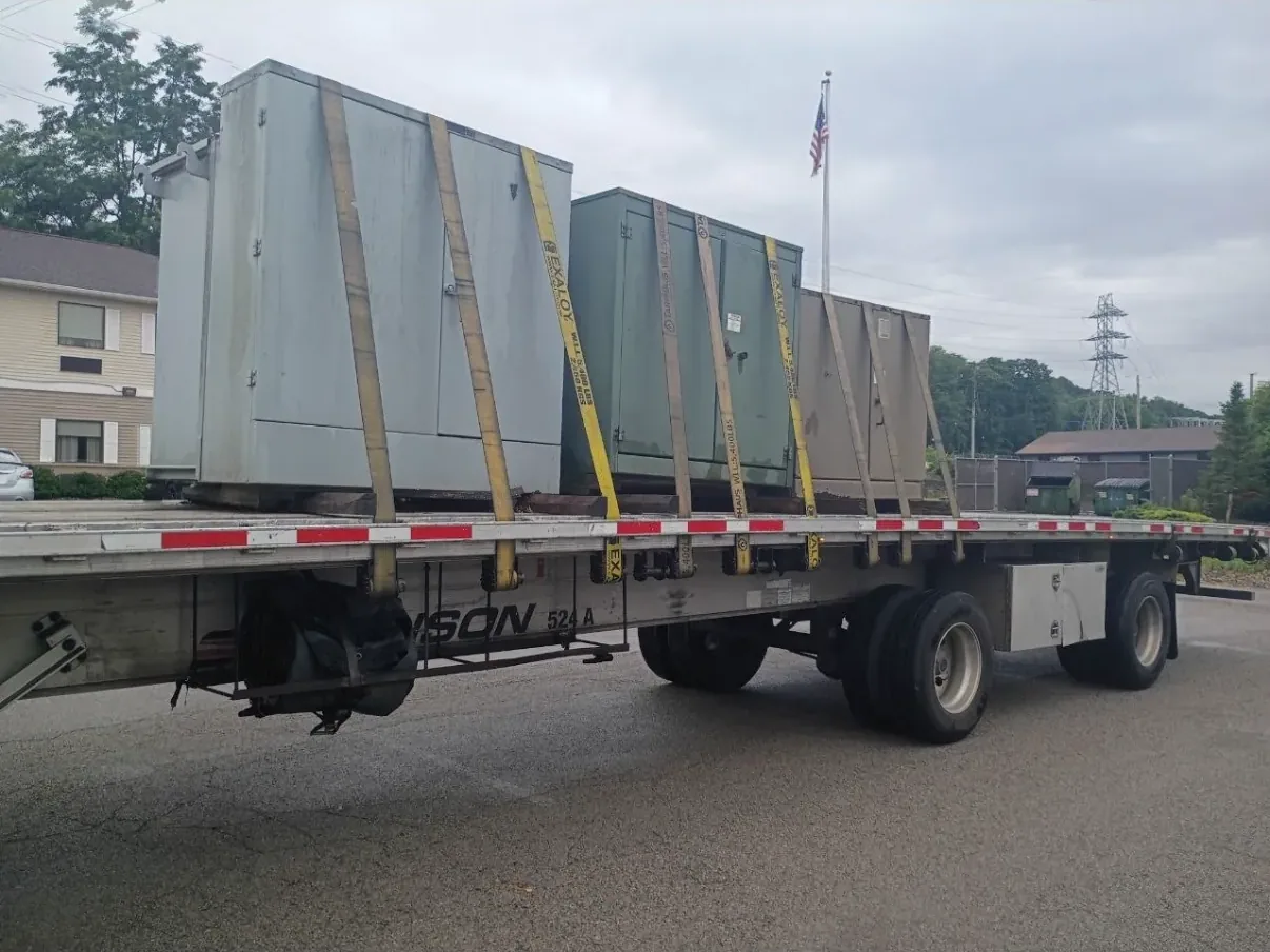 Wrapped and braced switchgear sections on a flatbed — Raleigh, NC