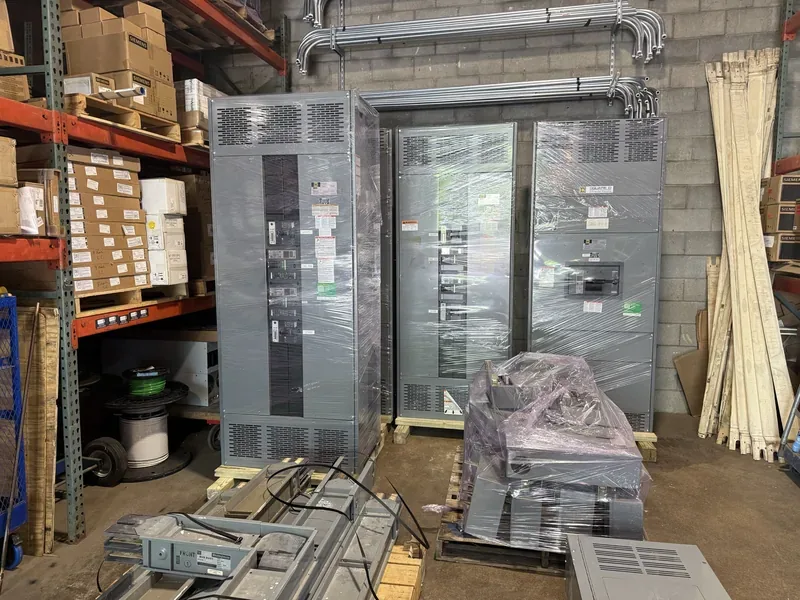 Panelboard and crated electrical parts in a warehouse — Jacksonville, FL