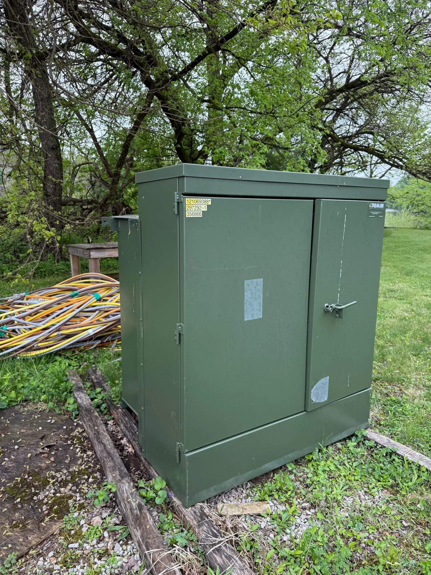 Green pad-mount transformer set on a concrete pad — Jacksonville, FL