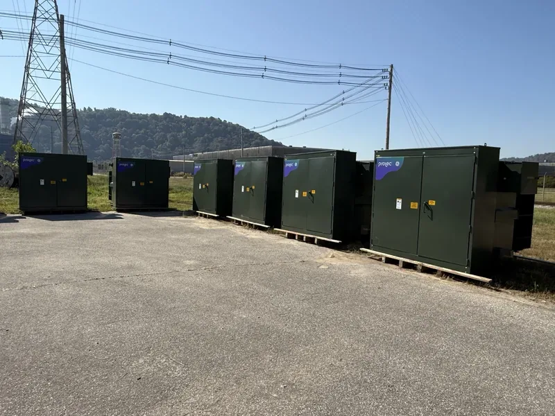 Line of pad-mount transformers under high-voltage transmission lines — Sarasota, FL
