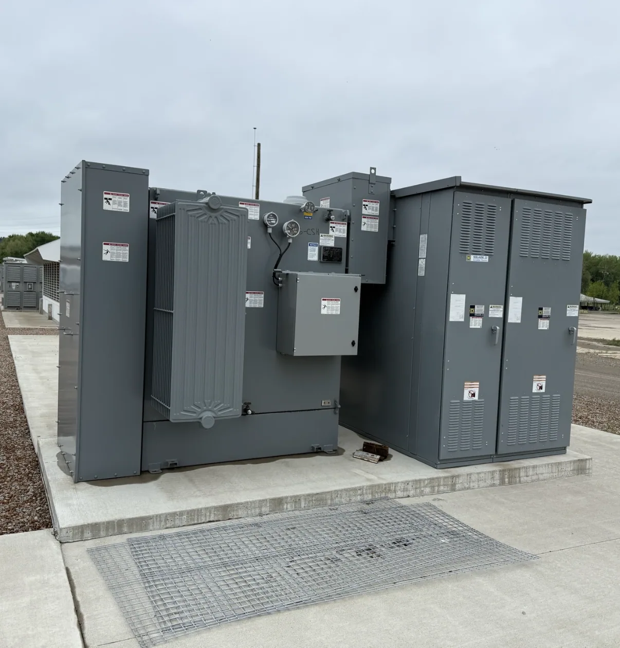 Pad-mount transformer and switching cabinet on a finished pad — Raleigh, NC