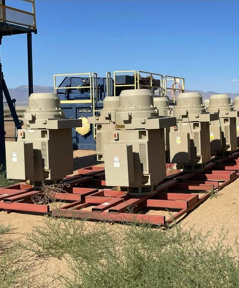 Row of distribution transformers on steel racks in a yard — Charlotte, NC
